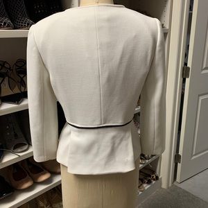 White jacket with black piping